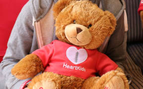 Heart Kids NZ ambassador Leighton Leevard with Maia Bear.