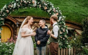 Jess and Sharik get surprised by Lord of the Rings star Elijah Wood at their wedding at Hobbiton, Matamata on 27 October, 2025.