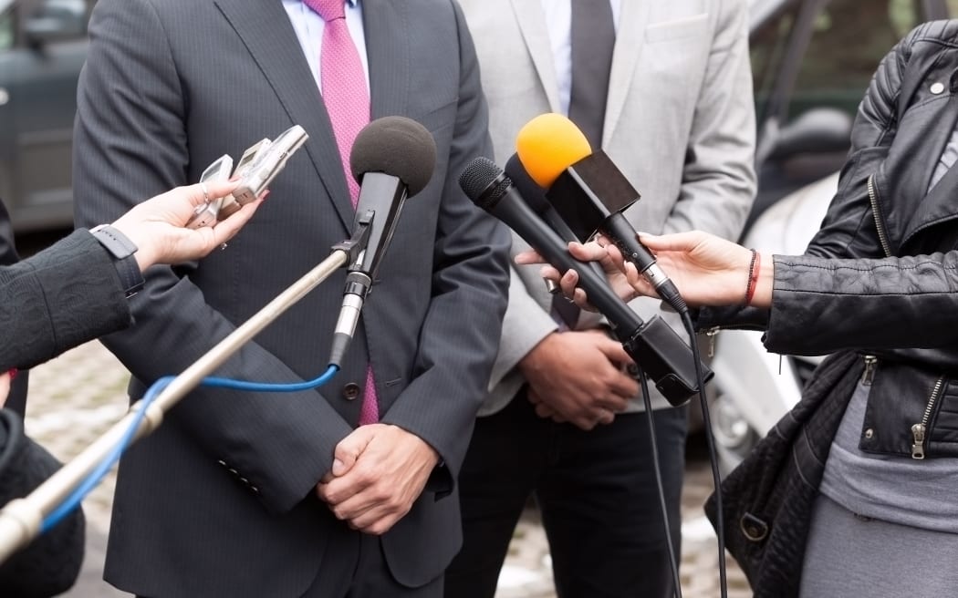 Journalists making media interview with businessperson or politician
