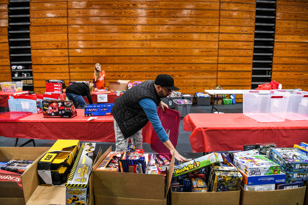 Samaritan's Purse volunteers distribute toys at a donation site in a Kentucky high school, two weeks after a string of deadly tornadoes hit several US states.