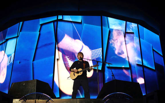 Ed Sheeran performs on stage at Mt Smart Stadium in Auckland.