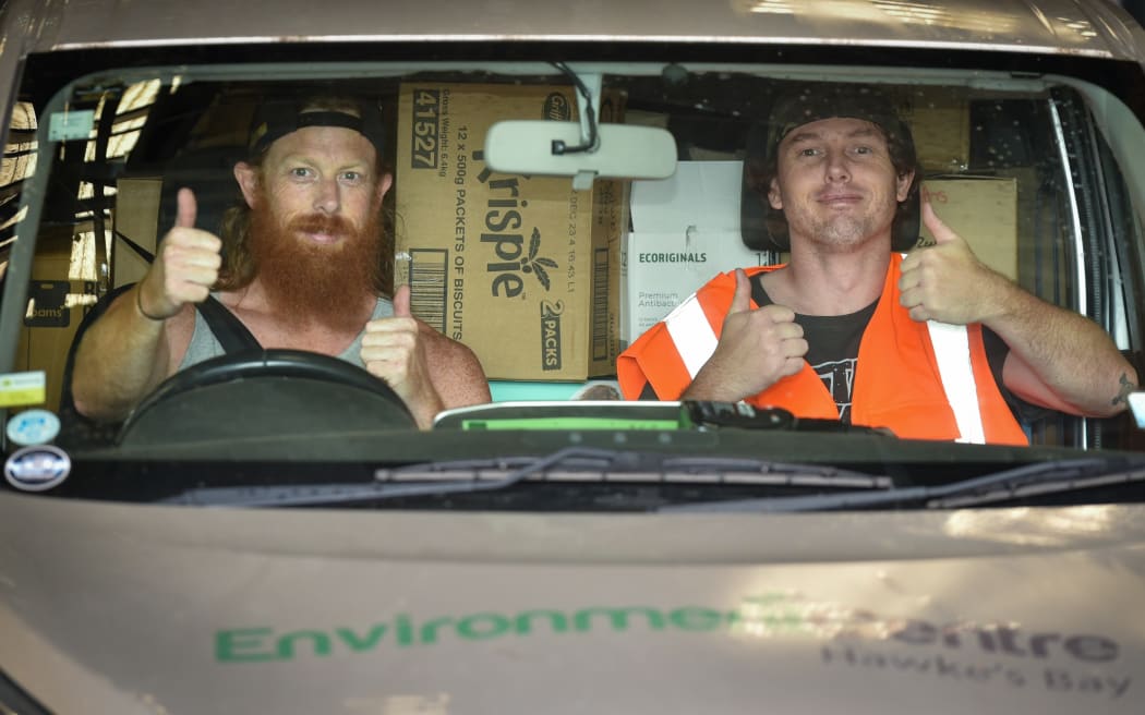 Two people helping deliver goods in response to Cyclone Gabrielle for The Environment Centre, Hawkes Bay.