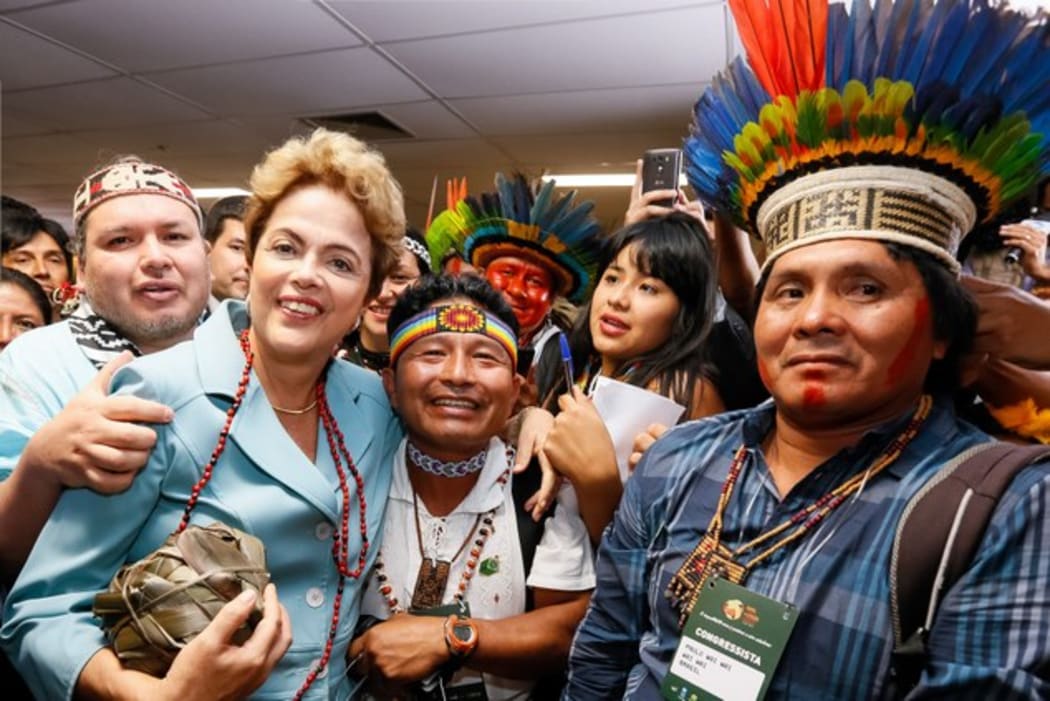 Brazilian president Dilma Rousseff holds a ki, or woven flax ball, in Brasilia.