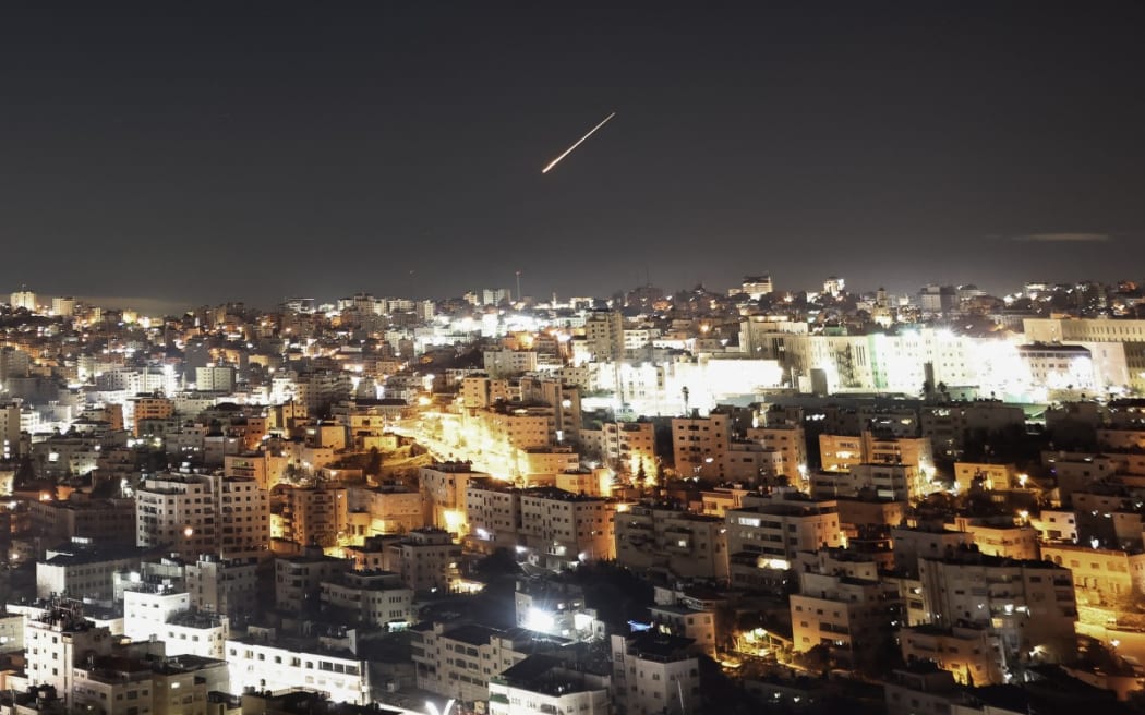 An Iranian projectile leaving a trail in the sky, seen from the West Bank city of Hebron early on 1 March, 2026.