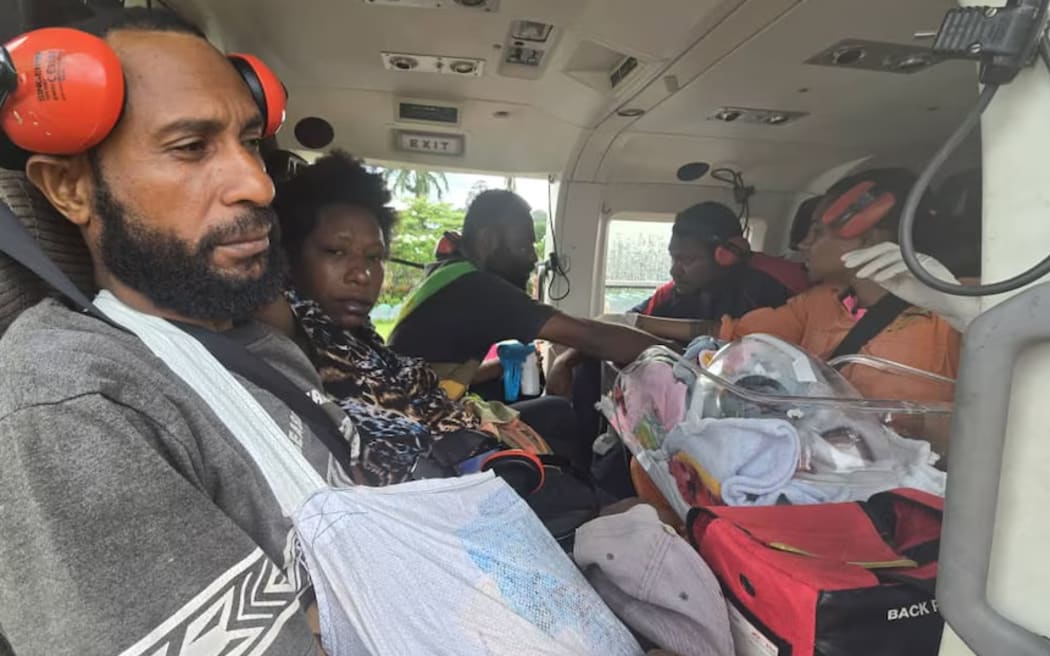 The twins, their parents, and medical staff flew to Port Moresby. (Supplied: Jurgen Ruh/ Manolos Aviation)