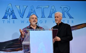 US producer Jon Landau (L) speaks as Canadian director/producer James Cameron looks on as they are honored with a hand and footprint ceremony at TCL Chinese theatre in Hollywood, California, on January 12, 2023. (Photo by Frederic J. Brown / AFP)