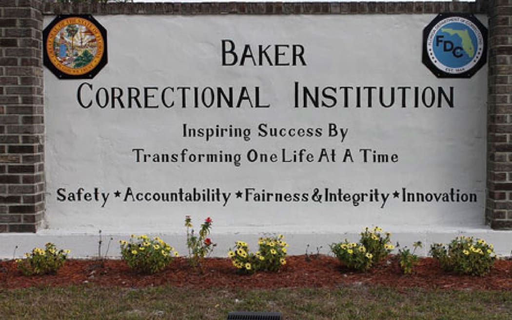 This undated image provided by the Florida Department of Corrections shows signage for the Baker Correctional Institution, a state prison about 43 miles west of downtown Jacksonville, Florida.