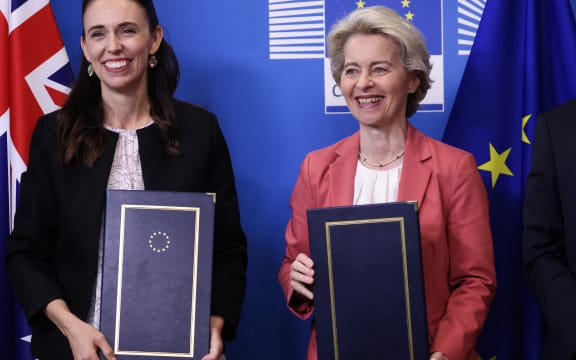 European Commission President Ursula von der Leyen  and New Zealand Prime Minister Jacinda Ardern pose for media after signing an Agreement on the exchange of personal data between Europol and New Zealand at EU headquarters in Brussels.
