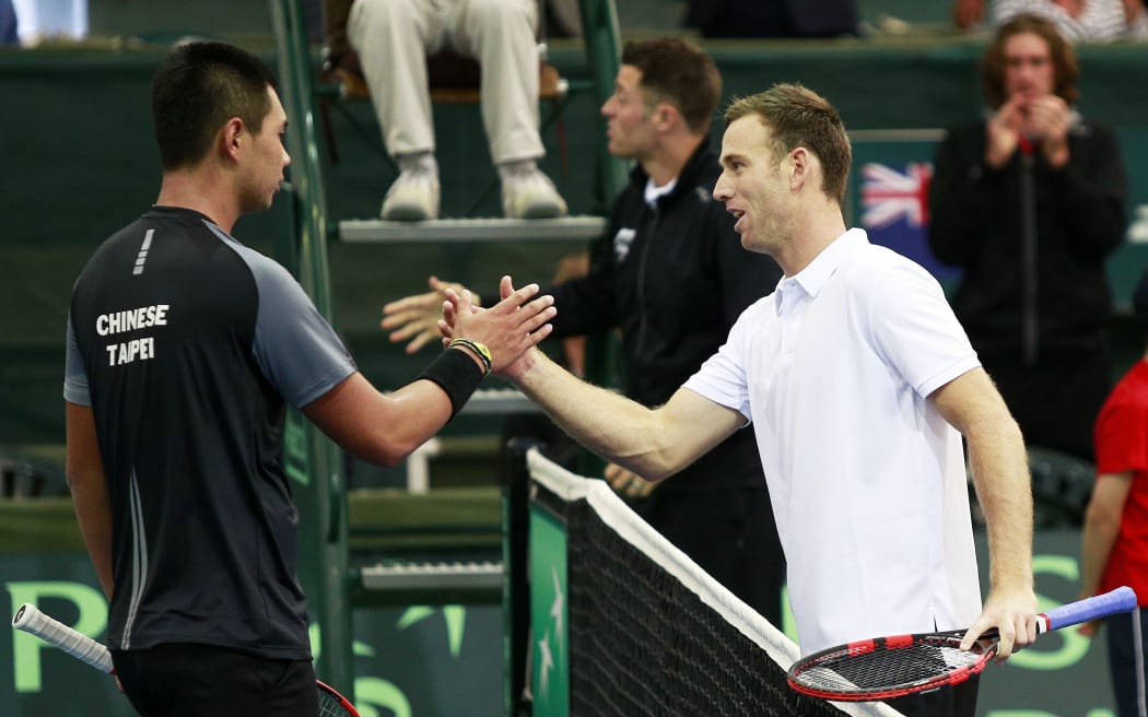 Michael Venus shakes hands with Chieh-Fu Wang after their match