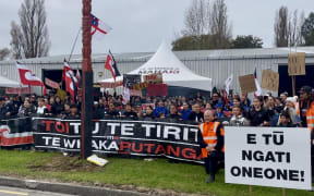 Ngāti Oneone people and supporters stand as one outside Te Pa Eketu Shed on Hirini St as the hapū starts an occupation which hapū chair Charlotte Gibson says will continue for “as long as it takes".