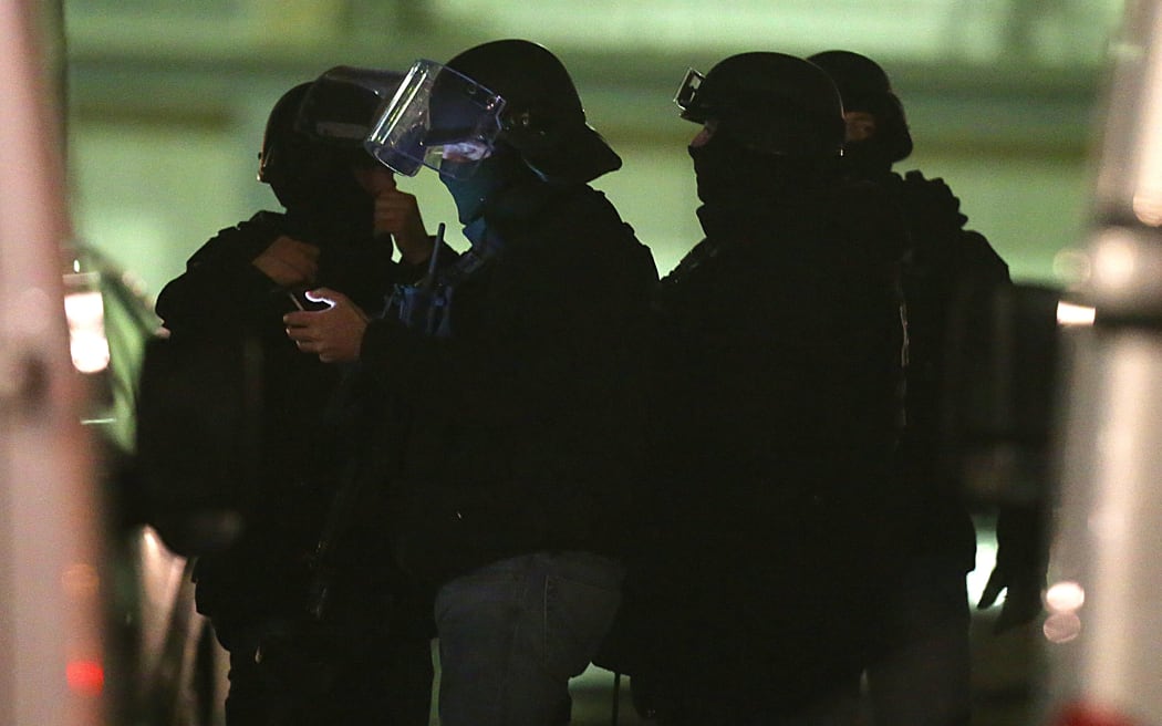 Police gather during the operation in the Croix-Rouge suburb of Reims.