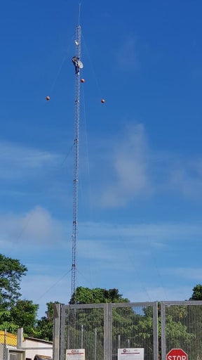 The protesting refugee scales the tower.