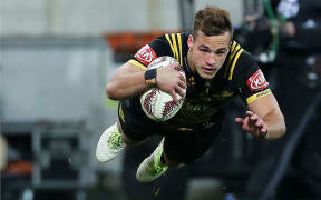 The Hurricanes' Wes Goosen goes in to score his try.