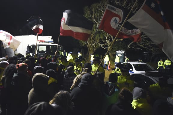 When police moved in, protectors spend long cold nights holding their presence.