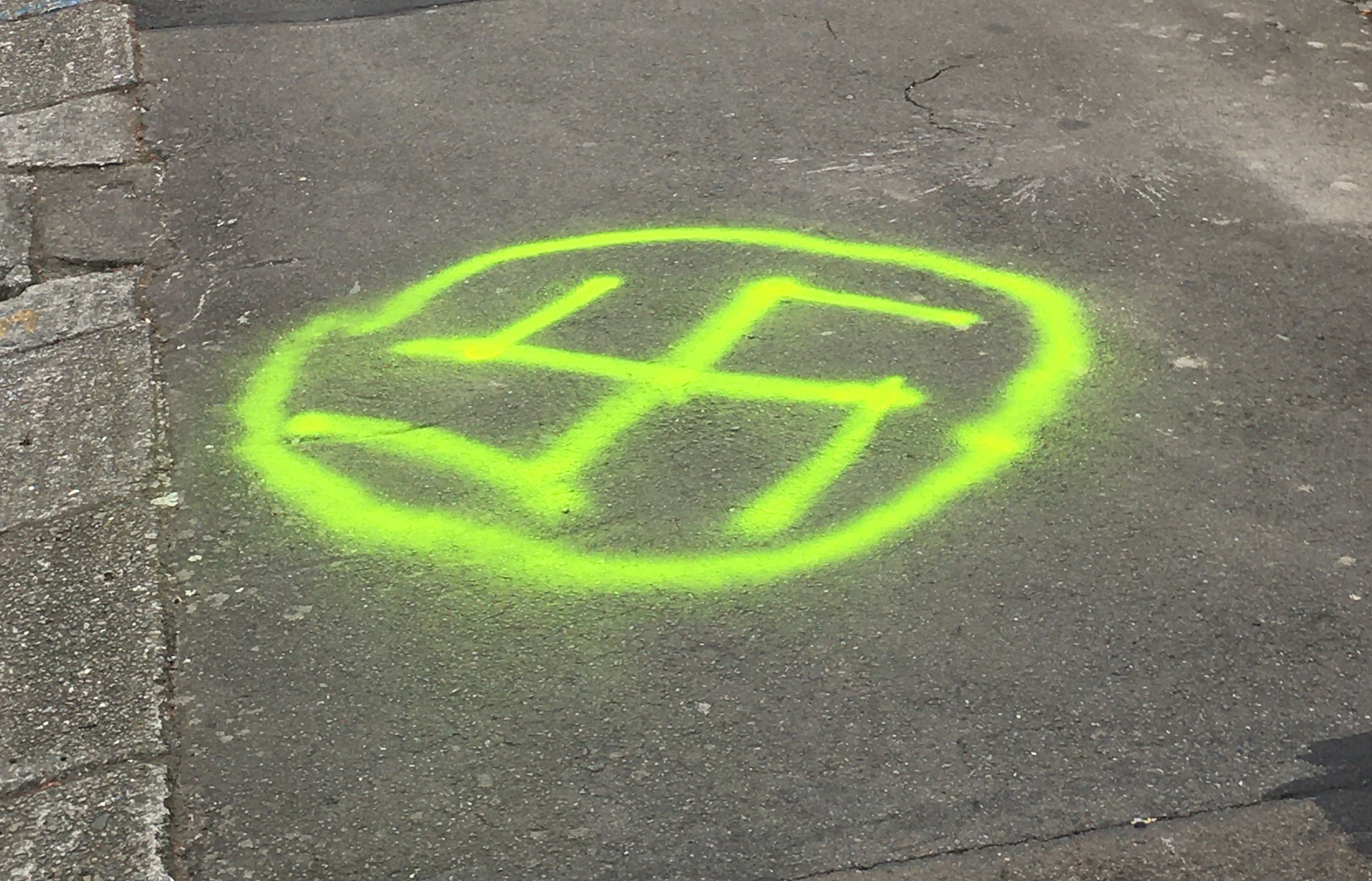 A swastika spray-painted outside Temple Sinai.