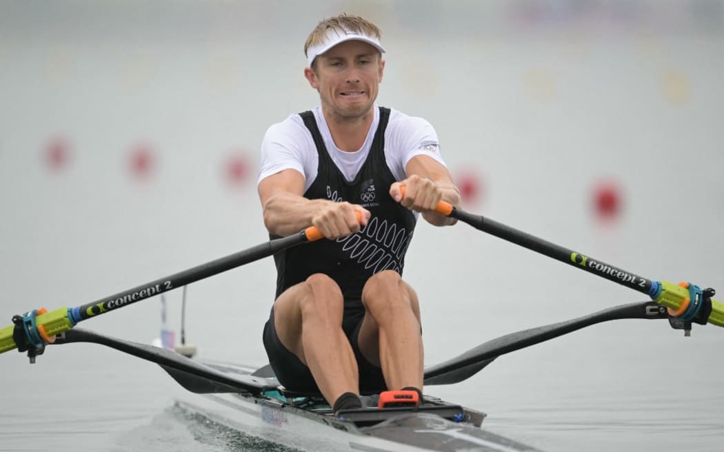 New Zealand's Thomas Mackintosh competes in the men's single sculls heats rowing competition at Vaires-sur-Marne Nautical Centre in Vaires-sur-Marne during the Paris 2024 Olympic Games on July 27, 2024. (Photo by Bertrand GUAY / AFP)