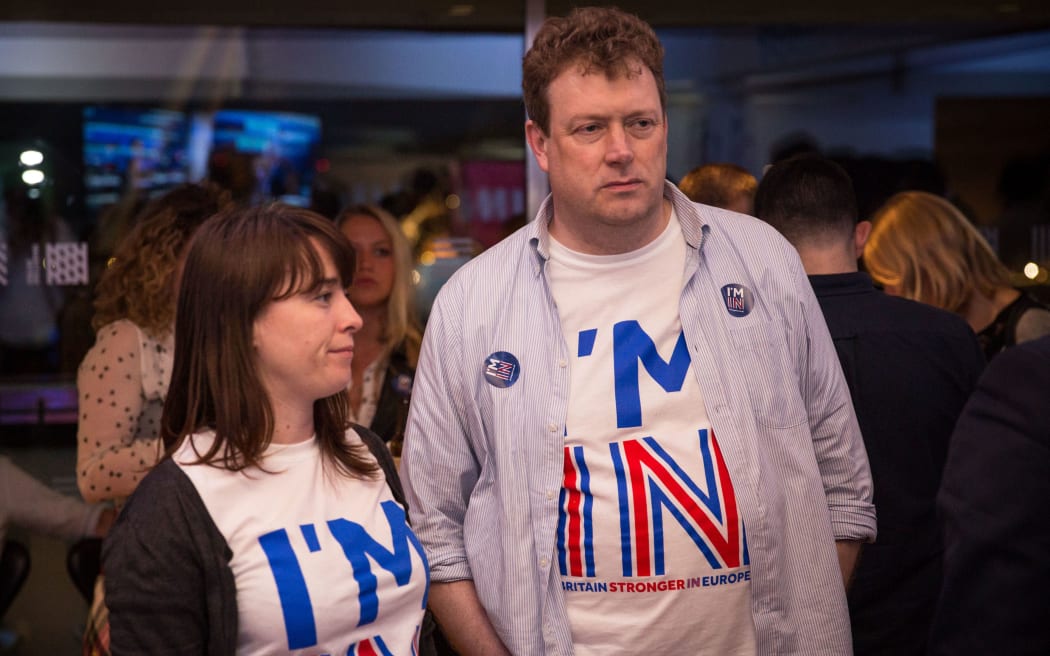 Supporters of the 'Stronger In' Campaign react as results of the EU referendum are announced at a results party at the Royal Festival Hall in London early in the morning of June 24, 2016.