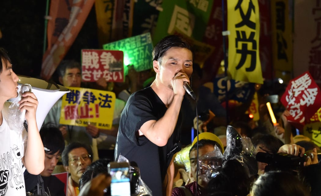 Students rally against Japanese PM's security bills which would allow troops to fight on foreign soil for the first time since World War II.