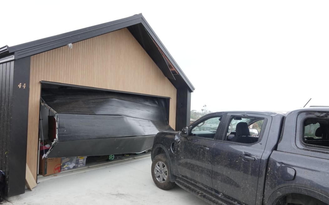 Garage door blown out, Old Waipu Road, Mangawhai, 26 January 2025.