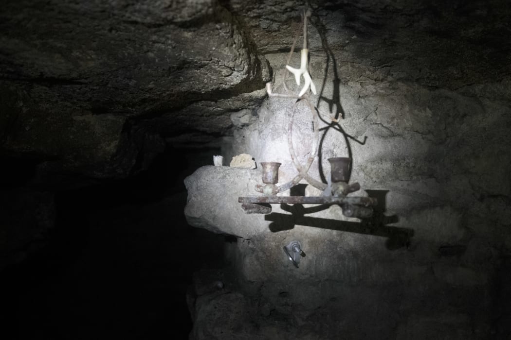 A room decorated by cataphiles in the banned catacombs of Paris.