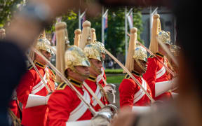 Crowds gather to view the Queen to be laid in state