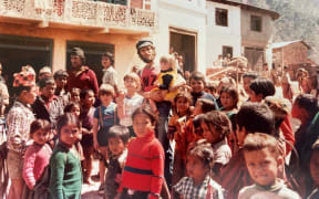 Greg Judkins with village children in Nepal.