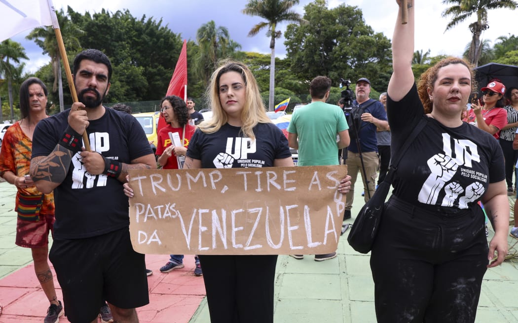Union members and students take part in a demonstration in support of Venezuela's President Nicolas Maduro at the Venezuelan embassy in Brasilia, Brazil, on January 3, 2026, after US forces captured Venezuelan leader Nicolas Maduro.