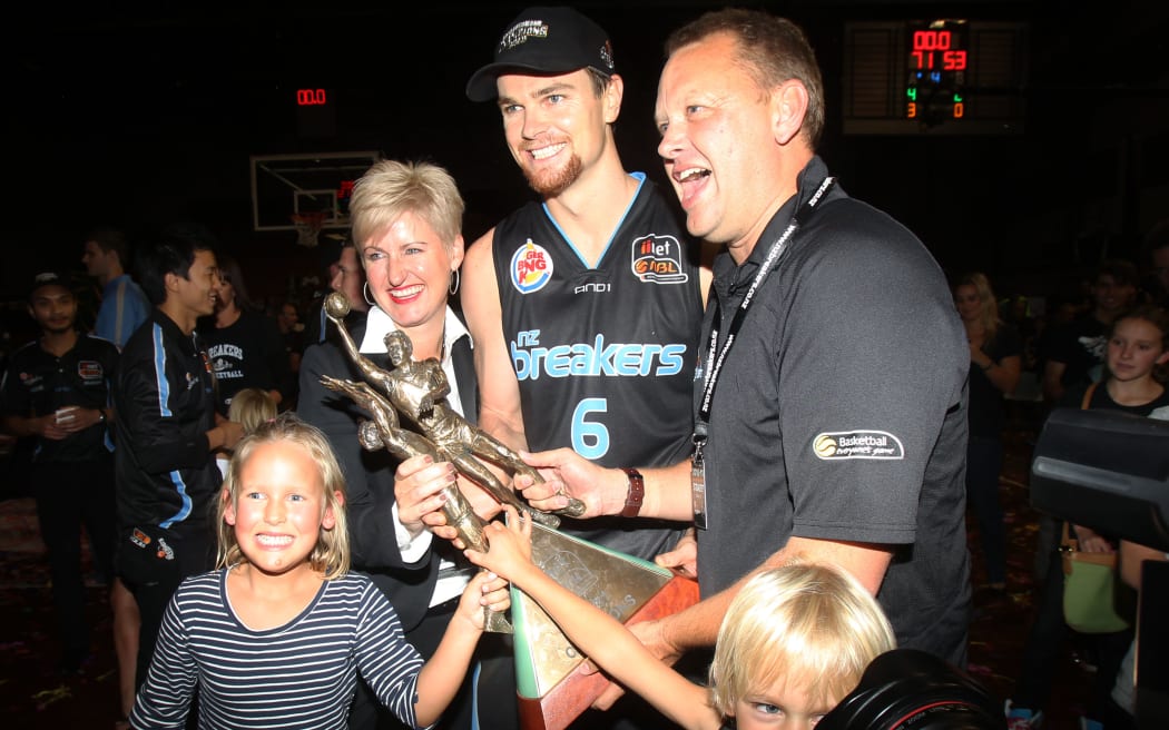 Breakers' Kirk Penney and owners Paul and Liz Blackwell with the Dr. John Raschke Trophy in 2011