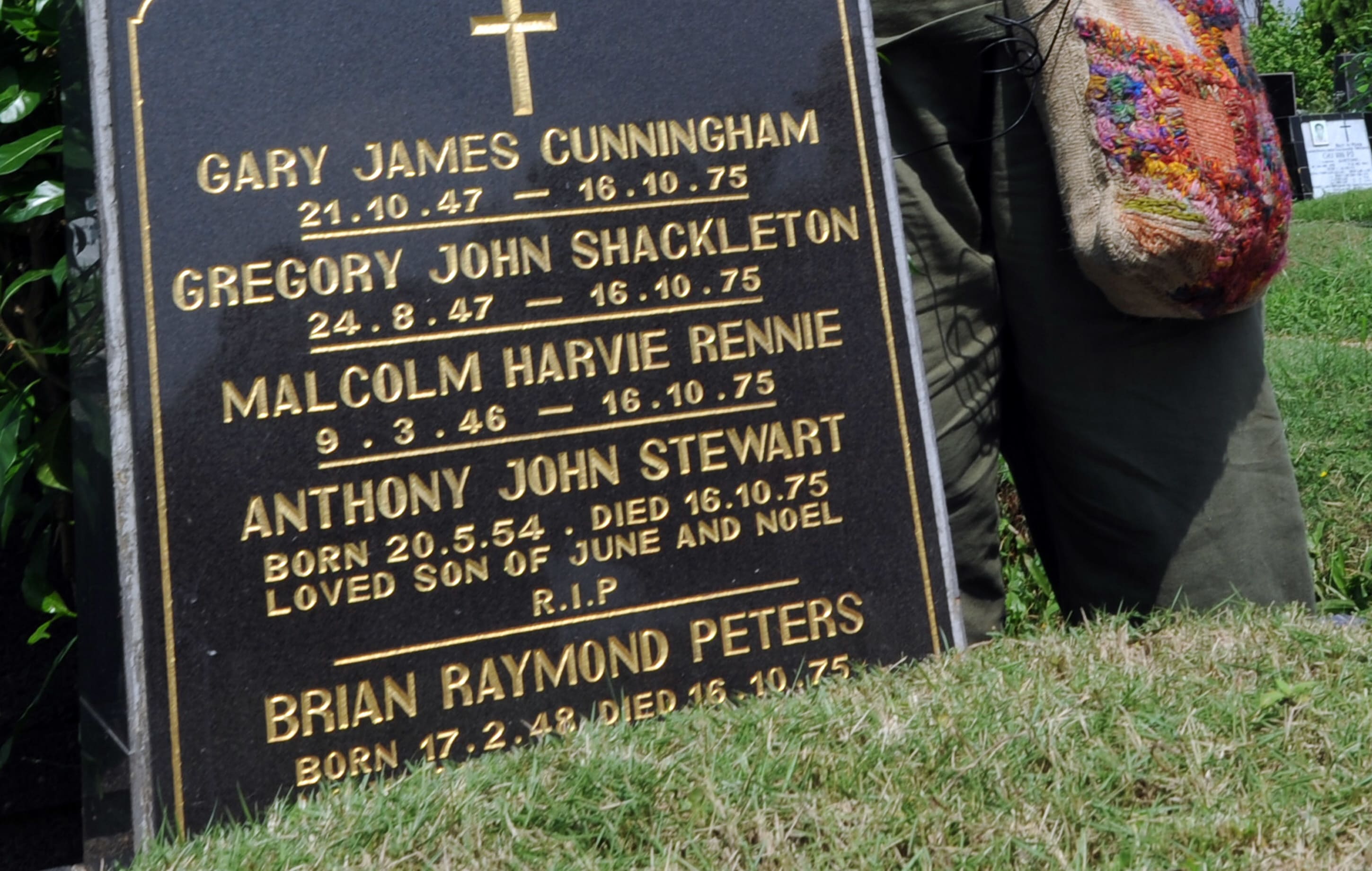 Australian Shirley Shackleton, wife of late Australian journalist Greg Shackleton, stands by the grave in Jakarta on July 9, 2010, where five journalists, the so-called Balibo Five, who were killed in East Timor in 1975, were buried.