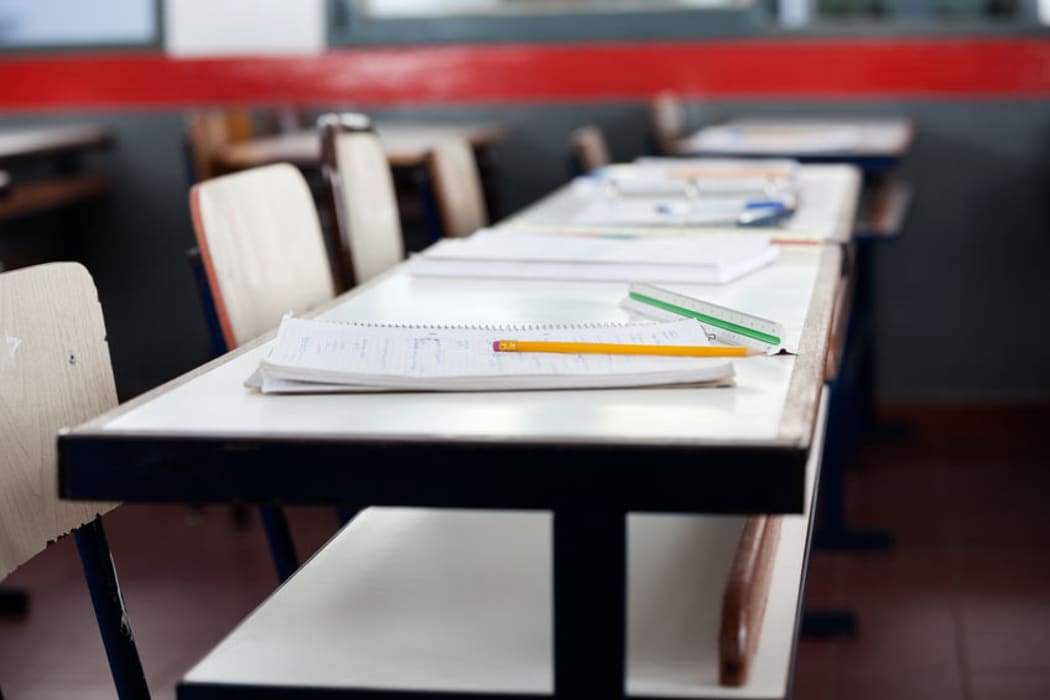 Empty desks in school classroom