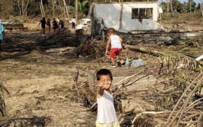 Children in Nuku'alofa in the aftermath of the eruption of Hunga Tonga-Hunga Ha'apai and tsunami.