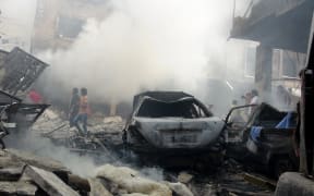 Smoke rises after Syrian army airstrikes in Idlib, Syria.