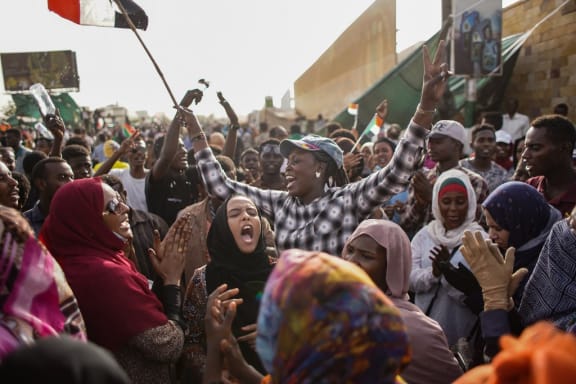 11 April 2019, Sudan, Khartoum: Sudanese demonstrators celebrate the arrest of long-time President Omar al-Bashir by the armed forces,