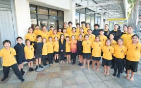 Students from Te Kura Kaupapa Māori O Hawaiki Hou outside the school's entrance on Gisborne's main street last month.