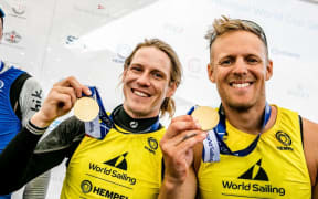 Paul Snow-Hansen and Dan Willcox after winning gold at the World Cup Series regatta in Genoa.