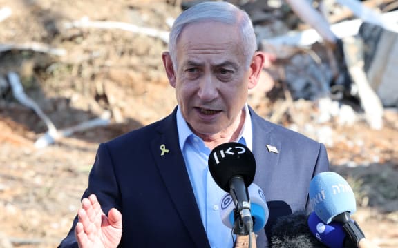 Israel's Prime Minister Benjamin Netanyahu gives a statement during a visit to the site of the Weizmann Institute of Science, which was hit by an Iranian missile barrage, in the central city of Rehovot on June 20, 2025. (Photo by Jack GUEZ / POOL / AFP)