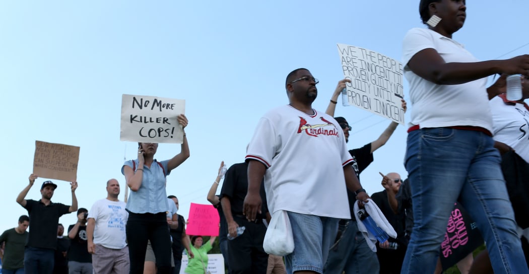 Demonstrators protesting the shooting death of Michael Brown in Ferguson, Missouri.