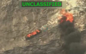 (FILES) This screen grab from a video posted by US President Donald Trump on his Truth Social account on September 15, 2025, shows what President Trump says is US Military forces conducting a strike on a boat carrying alleged drug traffickers in the Caribbean Sea in the SOUTHCOM area of responsibility on Monday, September 15, 2025. Venezuela said on September 19, 2025, it would seek a United Nations probe of US strikes that killed 14 alleged drug traffickers on at least two boats in international waters off its coast. (Photo by HANDOUT / US President Donald Trump's TRUTH Social account / AFP) / RESTRICTED TO EDITORIAL USE - MANDATORY CREDIT "AFP PHOTO /  US PRESIDENT DONALD TRUMP'S TRUTH SOCIAL ACCOUNT / HANDOUT"- HANDOUT - NO MARKETING NO ADVERTISING CAMPAIGNS - DISTRIBUTED AS A SERVICE TO CLIENTS