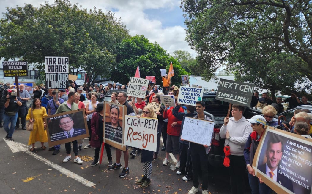Protesters outside David Seymour's electorate office in Auckland.