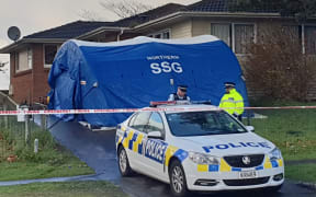 Police outside the area where a 17-year-old was found dead