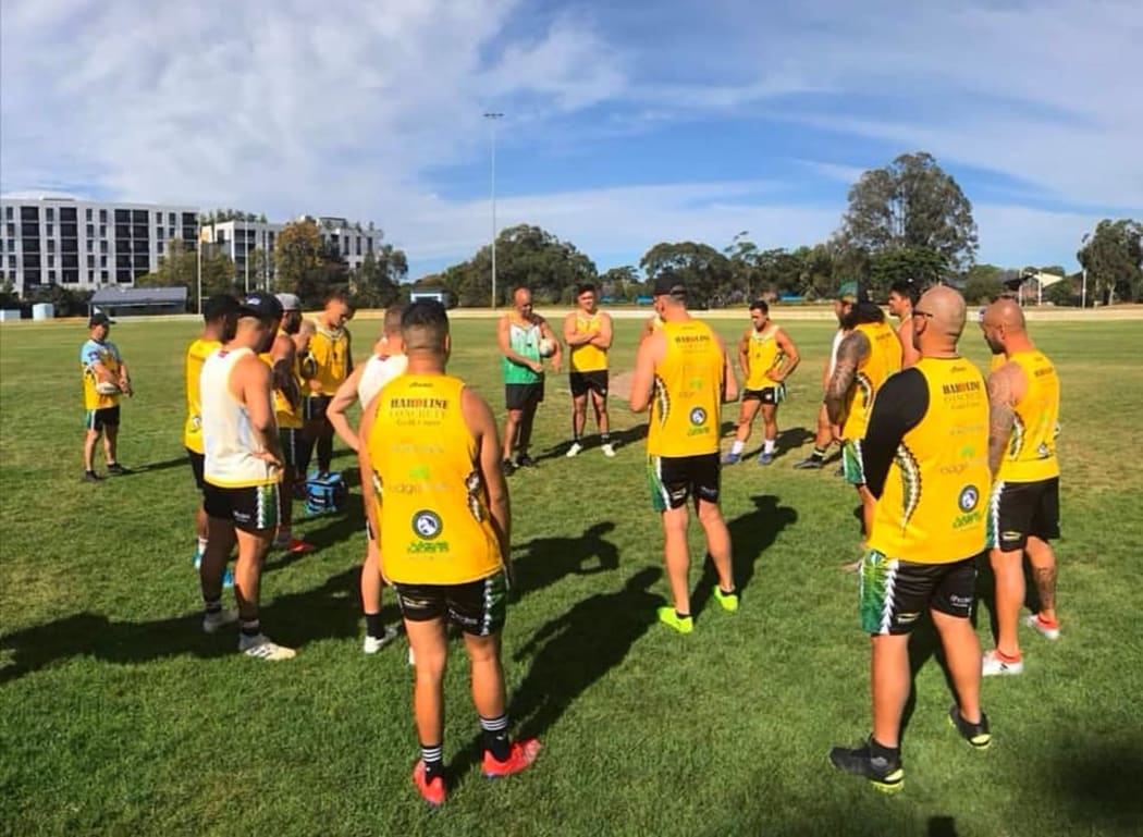 Cook Islands rugby league coach Tony Iro (top centre) issues instructions during training.