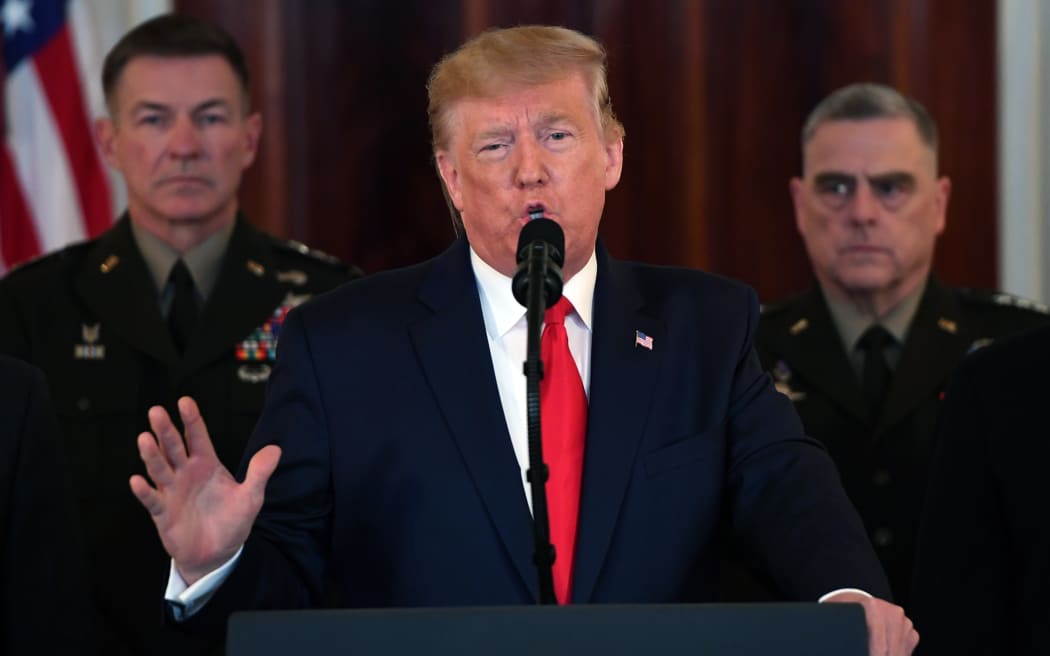 US President Donald Trump speaks about the situation with Iran in the Grand Foyer of the White House.