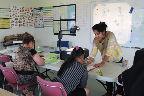 Indu Bajwa with her ESOL students, Paptoetoe