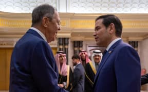In this handout picture released by the official Saudi Press Agency (SPA), US Secretary of State Marco Rubio (R) shakes hands with Russian Foreign Minister Sergei Lavrov during their meeting at Diriyah Palace, in Riyadh, Saudi Arabia, on February 18, 2025. The desert kingdom hosted US-Russia talks, state media reported on February 18. (Photo by SPA / AFP) / RESTRICTED TO EDITORIAL USE - MANDATORY CREDIT "AFP PHOTO / SPA " - NO MARKETING NO ADVERTISING CAMPAIGNS - DISTRIBUTED AS A SERVICE TO CLIENTS