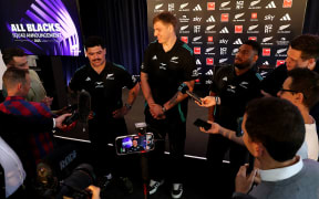 All Black debutants (L-R) Du'Plessis Kirifi, Fabian Holland and Timoci Tavatavanawai talk with media during the New Zealand All Blacks 2025 Squad Announcement at Coastal Rugby Club.