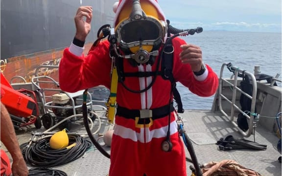 Bay Underwater Services diver having a little Christmas cheer while out at sea cleaning ships on Christmas Day 2022.