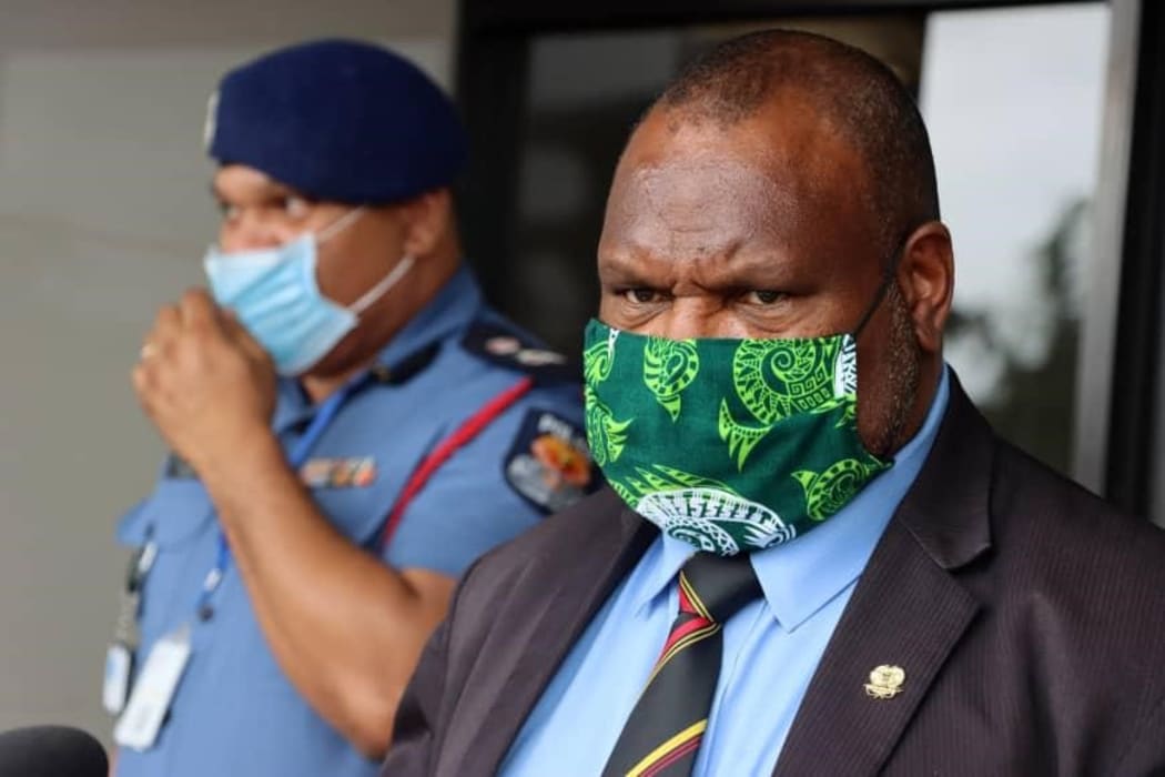 PNG's police commissioner David Manning (left) and prime minister James Marape