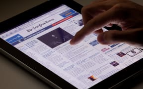 Hong Kong, China - August 7, 2011: Image of browsing the New York Times website using an ipad. The New York Times is a popular American daily newspaper and its website is the most popular American online newspaper website.