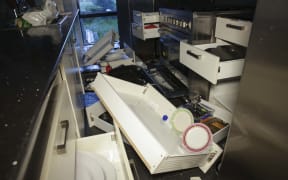 Mark Solomon's kitchen contents emptied onto the floor.