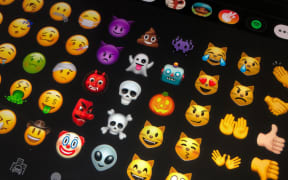 09 July 2020, Berlin: Different emojis are shown on a tablet. From meanwhile more than 3000 different Emojis you can find the right Emoji for almost every occasion. Photo: Jörg Carstensen/dpa (Photo by Jörg Carstensen / DPA / dpa Picture-Alliance via AFP)
